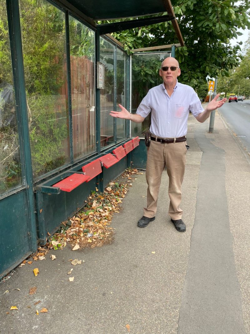 Cherry Hinton councillor Russ McPherson at a bus stop on Coldham